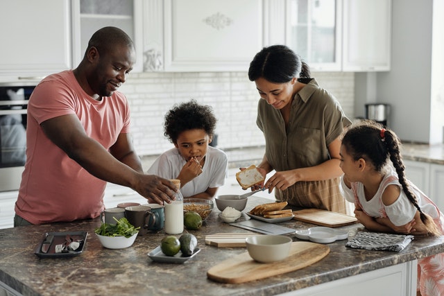 Family making their breakfast together