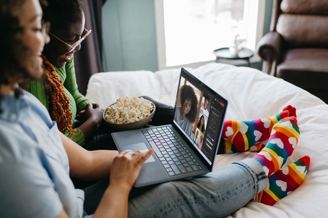 Two women talking on a video call on a laptop