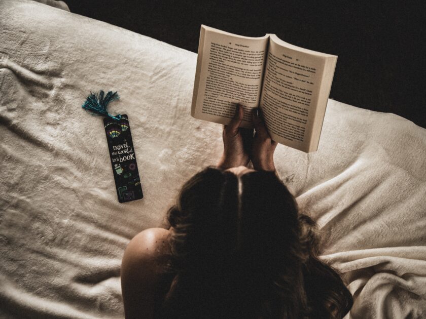 a girl is reading a book 