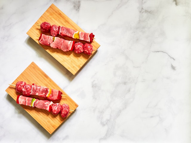 Red meat on two wooden board 