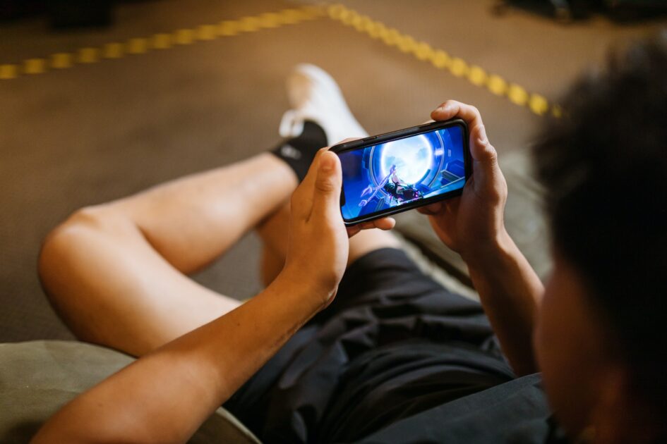 A boy playing a game on mobile